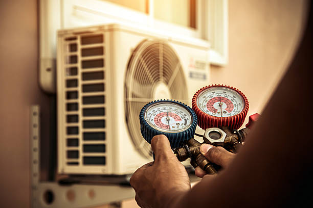 Professional Air Conditioning Service technician working in Harrod, OH